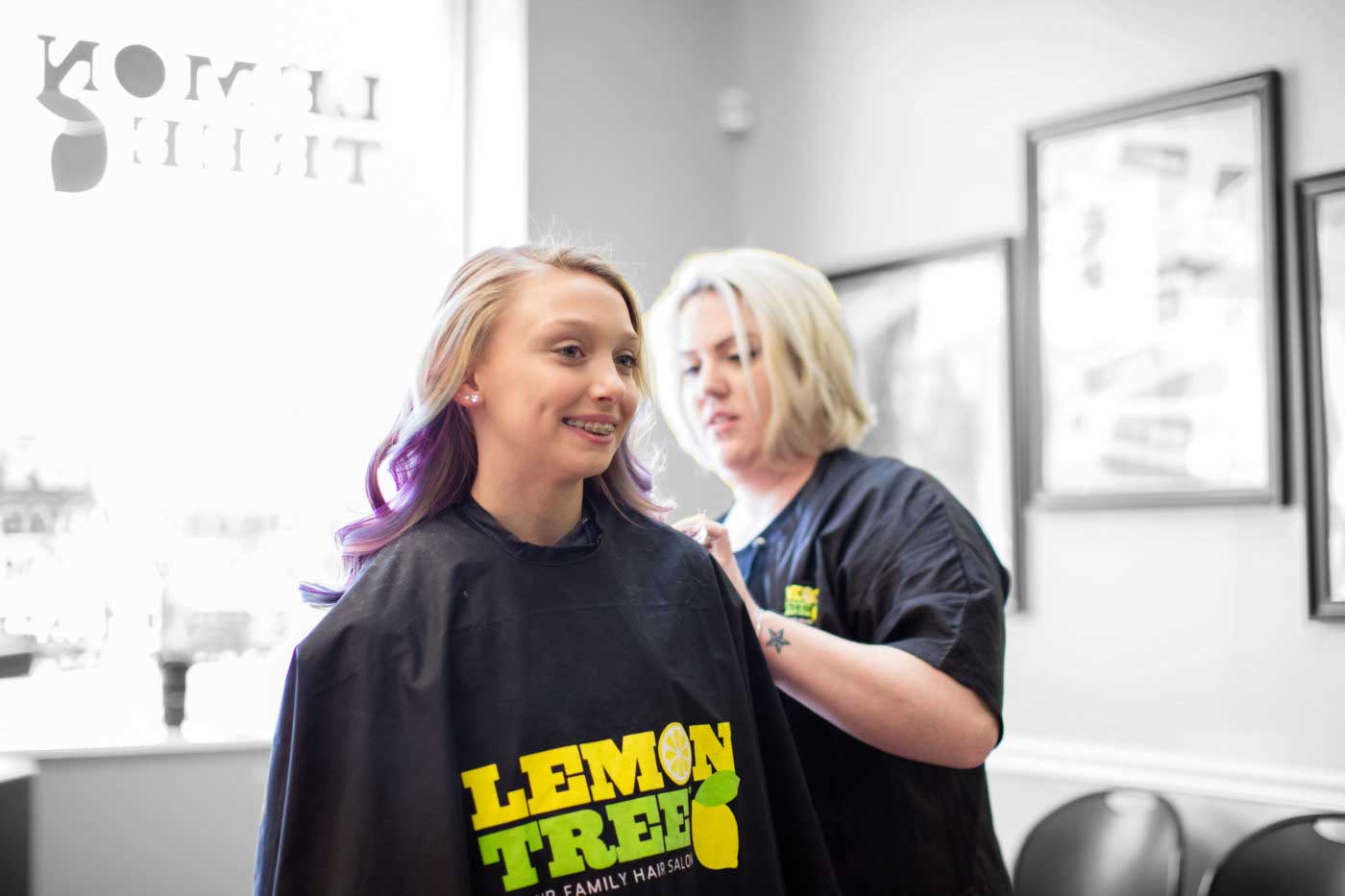 Child getting her hair cut from a Lemon Tree Hair Salons hair salon for sale.