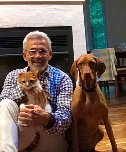 Dog Training Elite franchies owner Doug Pfaff, his dog, and cat.