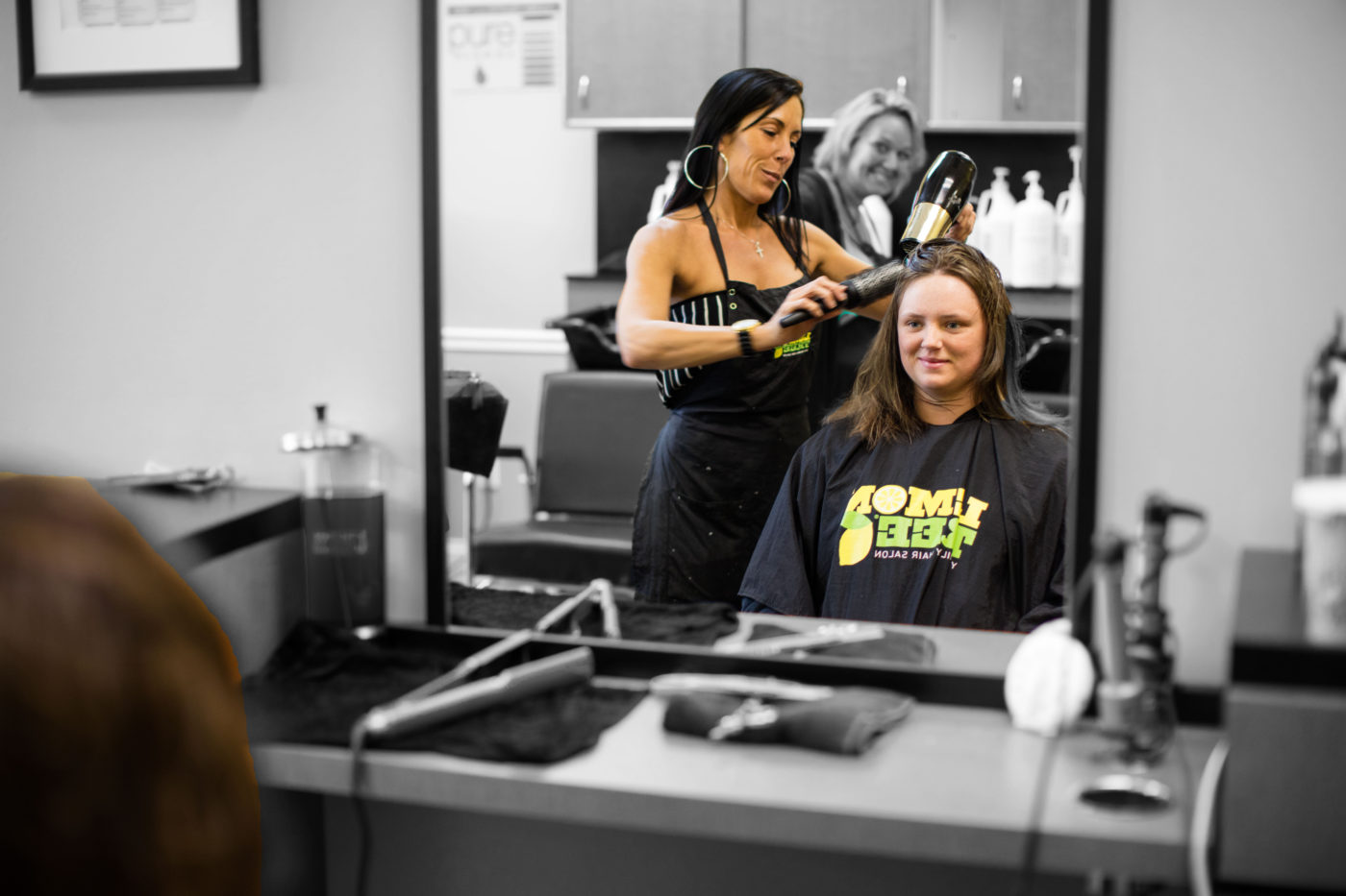 A professional stylist at Lemon Tree gives a girl a fresh, new 'do.