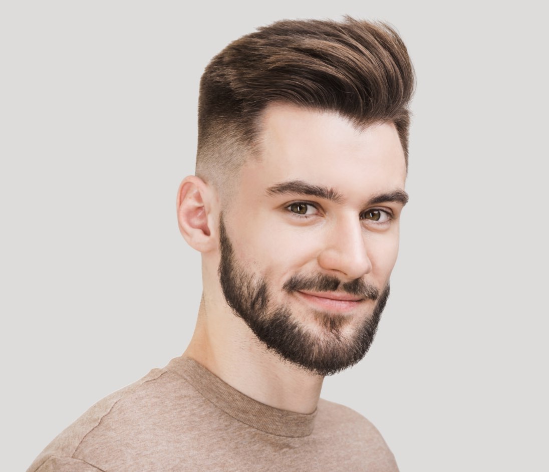 A man with well styled hair and nicely trimmed facial hair, courtesy of Lemon Tree.